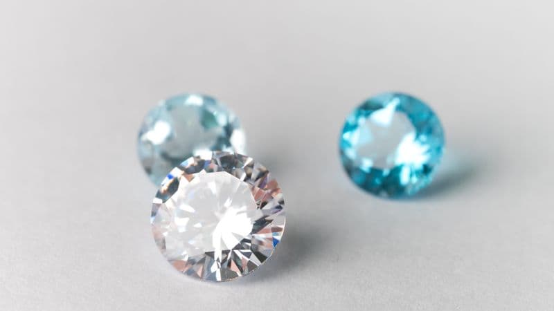 Cut and polished gemstones on a light surface