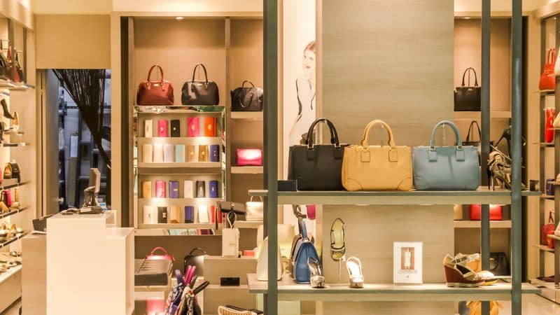 Luxury retail boutique interior with handbags and accessories
